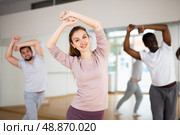 Young woman learning dynamic dances in choreography class. Стоковое фото, фотограф Яков Филимонов / Фотобанк Лори