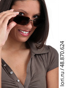 Woman peering over sunglasses. Стоковое фото, агентство Ingram Publishing / Фотобанк Лори