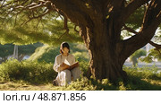 Shadows of Wisdom: woman finds solace and knowledge as she peacefully reads a book under the inviting shade of a majestic tree. Стоковое AI-изображение, AI-художник Данила Большаков / Фотобанк Лори