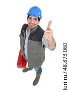 Worker giving the thumb&rsquo;s up. Стоковое фото, агентство Ingram Publishing / Фотобанк Лори