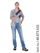 Woman holding a power tool. Стоковое фото, агентство Ingram Publishing / Фотобанк Лори