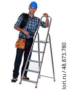 Tradesman standing next to a stepladder. Стоковое фото, агентство Ingram Publishing / Фотобанк Лори