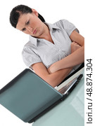 Woman pouting in front of her computer. Стоковое фото, агентство Ingram Publishing / Фотобанк Лори