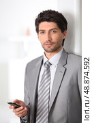Executive with mobile phone. Стоковое фото, агентство Ingram Publishing / Фотобанк Лори