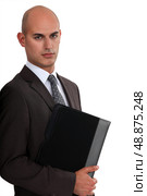 Bald businessman holding folder. Стоковое фото, агентство Ingram Publishing / Фотобанк Лори