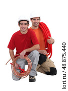 Plumbers with traditional copper pipe. Стоковое фото, агентство Ingram Publishing / Фотобанк Лори