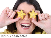 woman laughing and hiding her eyes with flowers. Стоковое фото, агентство Ingram Publishing / Фотобанк Лори
