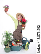 little girl gardening isolated on white. Стоковое фото, агентство Ingram Publishing / Фотобанк Лори