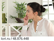 Woman looking at her plants. Стоковое фото, агентство Ingram Publishing / Фотобанк Лори