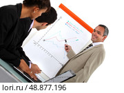 Businessman with a flipchart. Стоковое фото, агентство Ingram Publishing / Фотобанк Лори