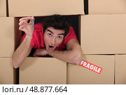 Excited young man holding the keys to his new place. Стоковое фото, агентство Ingram Publishing / Фотобанк Лори