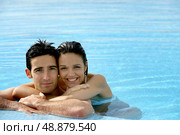 beautiful couple in a swimming pool. Стоковое фото, агентство Ingram Publishing / Фотобанк Лори