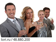 Couples drinking champagne. Стоковое фото, агентство Ingram Publishing / Фотобанк Лори