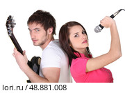 Man guitarist and woman singer on white background. Стоковое фото, агентство Ingram Publishing / Фотобанк Лори