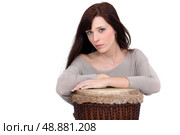 A woman playing the drum. Стоковое фото, агентство Ingram Publishing / Фотобанк Лори