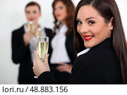 three business women drinking sparkling wine. Стоковое фото, агентство Ingram Publishing / Фотобанк Лори