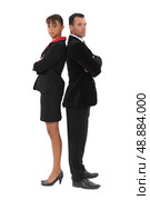 Businessman and businesswoman standing back-to-back. Стоковое фото, агентство Ingram Publishing / Фотобанк Лори