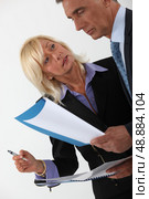 mature secretary and businessman interacting. Стоковое фото, агентство Ingram Publishing / Фотобанк Лори