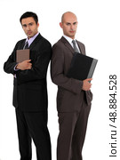Businessmen standing back to back. Стоковое фото, агентство Ingram Publishing / Фотобанк Лори