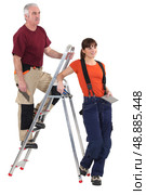 Tiler and female helper. Стоковое фото, агентство Ingram Publishing / Фотобанк Лори