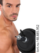 man lifting weight. Стоковое фото, агентство Ingram Publishing / Фотобанк Лори