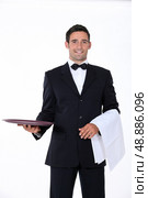 well dressed waiter facing the camera. Стоковое фото, агентство Ingram Publishing / Фотобанк Лори