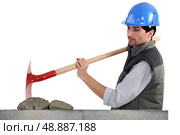 Worker with spade and cement. Стоковое фото, агентство Ingram Publishing / Фотобанк Лори