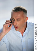 Shocker businessman talking on the phone. Стоковое фото, агентство Ingram Publishing / Фотобанк Лори