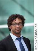 Portrait of African American worker with glasses. Стоковое фото, агентство Ingram Publishing / Фотобанк Лори