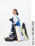 little girl dressed in house painter. Стоковое фото, агентство Ingram Publishing / Фотобанк Лори