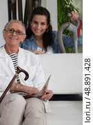 Woman helping an elderly lady. Стоковое фото, агентство Ingram Publishing / Фотобанк Лори