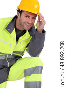 Traffic guard wearing hard hat. Стоковое фото, агентство Ingram Publishing / Фотобанк Лори