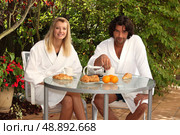 Couple eating breakfast on the terrace. Стоковое фото, агентство Ingram Publishing / Фотобанк Лори