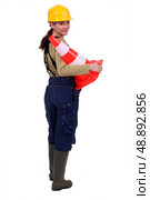 female bricklayer holding construction cone isolated on white. Стоковое фото, агентство Ingram Publishing / Фотобанк Лори