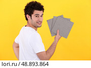 portrait of handyman installing tiles. Стоковое фото, агентство Ingram Publishing / Фотобанк Лори