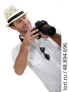 man with DSLR camera. Стоковое фото, агентство Ingram Publishing / Фотобанк Лори