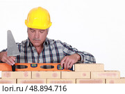 craftsman working with a level. Стоковое фото, агентство Ingram Publishing / Фотобанк Лори