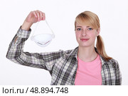 Woman holding face mask. Стоковое фото, агентство Ingram Publishing / Фотобанк Лори