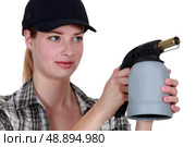 Woman with a blowtorch. Стоковое фото, агентство Ingram Publishing / Фотобанк Лори