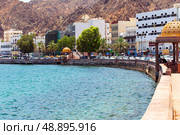 Mutrah Corniche with the Mutrah Fort in Muscat. View of a fort in Muttrah district of Muscat. Sultanate of Oman. Редакционное фото, фотограф Евгений Ткачёв / Фотобанк Лори