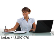 businesswoman working at her desk. Стоковое фото, агентство Ingram Publishing / Фотобанк Лори