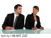Businessman cheating in exam. Стоковое фото, агентство Ingram Publishing / Фотобанк Лори
