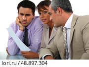 Three professionals in meeting. Стоковое фото, агентство Ingram Publishing / Фотобанк Лори