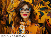 Spectacled Sophistication: Visionary Woman Embracing Vibrant Chromaticity, stylish woman wearing glasses confidently standing in front of a brilliantly colored wall. Стоковое AI-изображение, AI-художник Данила Большаков / Фотобанк Лори