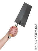 Hand holding a bucket trowel. Стоковое фото, агентство Ingram Publishing / Фотобанк Лори