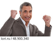 Victorious man isolated on white background. Стоковое фото, агентство Ingram Publishing / Фотобанк Лори