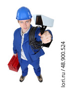 Tradesman holding a surveillance camera. Стоковое фото, агентство Ingram Publishing / Фотобанк Лори