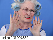 Elder upset with curlers in her hair. Стоковое фото, агентство Ingram Publishing / Фотобанк Лори