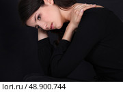 Wistful woman in black. Стоковое фото, агентство Ingram Publishing / Фотобанк Лори