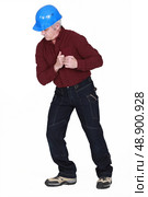 Tradesman staring at the floor. Стоковое фото, агентство Ingram Publishing / Фотобанк Лори